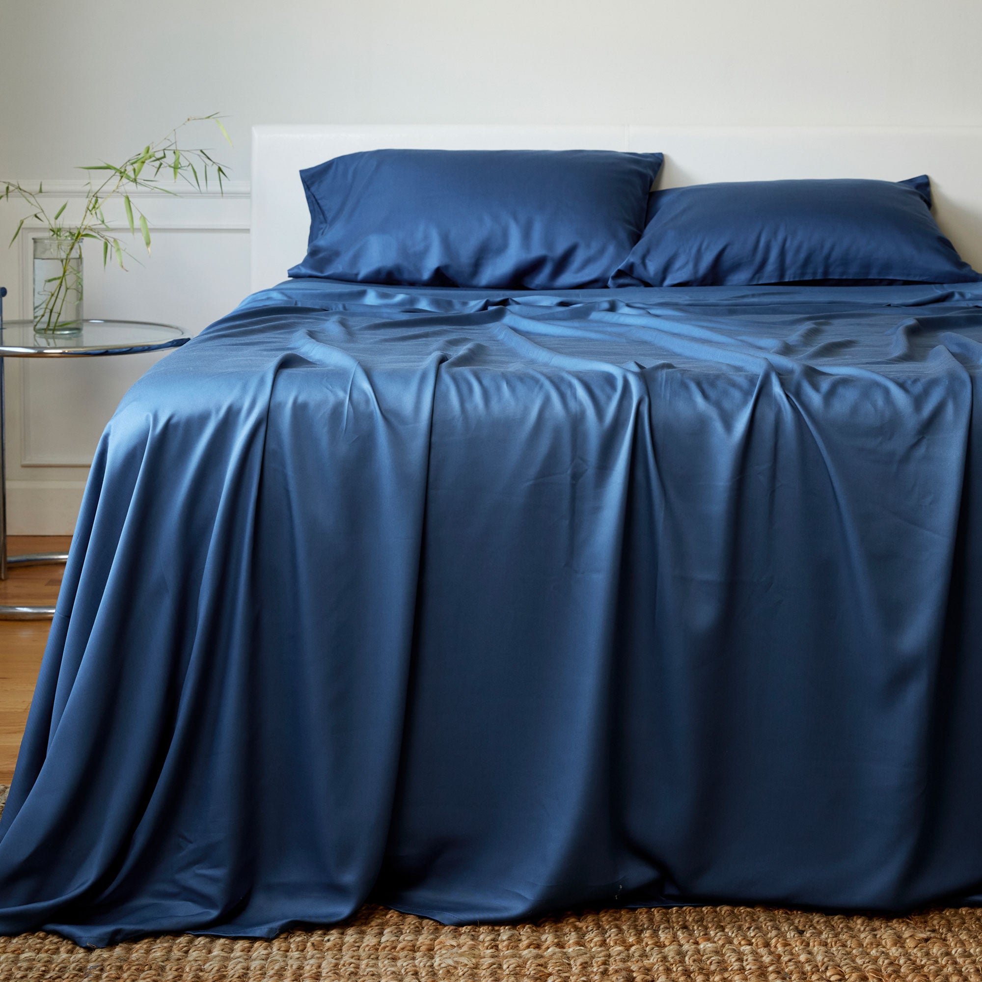 indigo bamboo sheet set and pillows on an elegant bed Bedvoyage Bamboo Sheet set blue